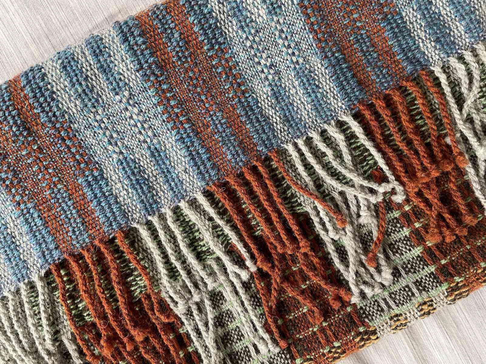 woven scarf with hand tied tassles